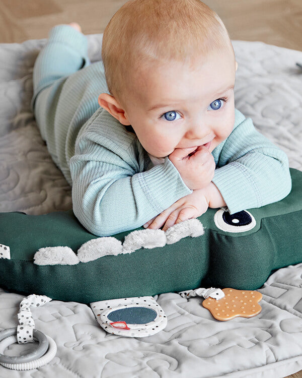 Croco tummy time pillow let your baby enjoy tummy time with sensory features