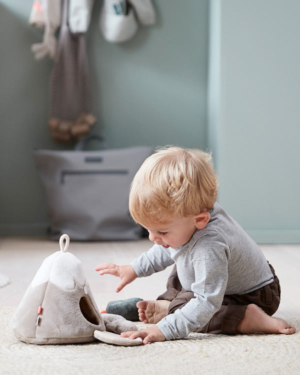 child playing hide and seek with Done by Deer hide-and-seek mountain