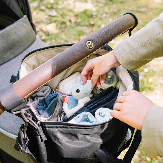 Done by Deer quilted changing bag on a stroller